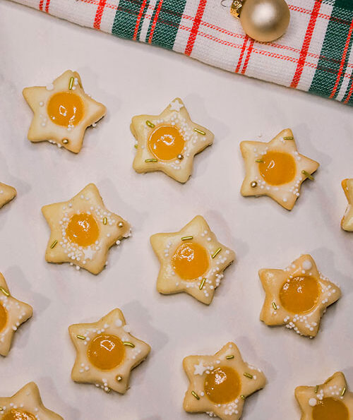 vegane Zitronenstern Plätzchen aus Mürbeteig, gefüllt mit veganem Lemon Curd